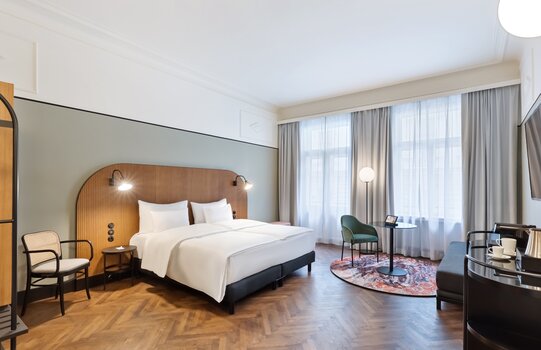 Interior view of the Premium room category at Hotel Astoria with a view of the double bed