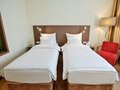 Classic Einzelzimmer mit Twin Bett und Nachttisch | Hotel Doppio in Wien