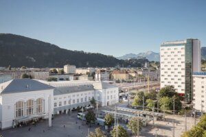 Exterior view with view to the train station and Salzburg city | Hotel Europa Salzburg