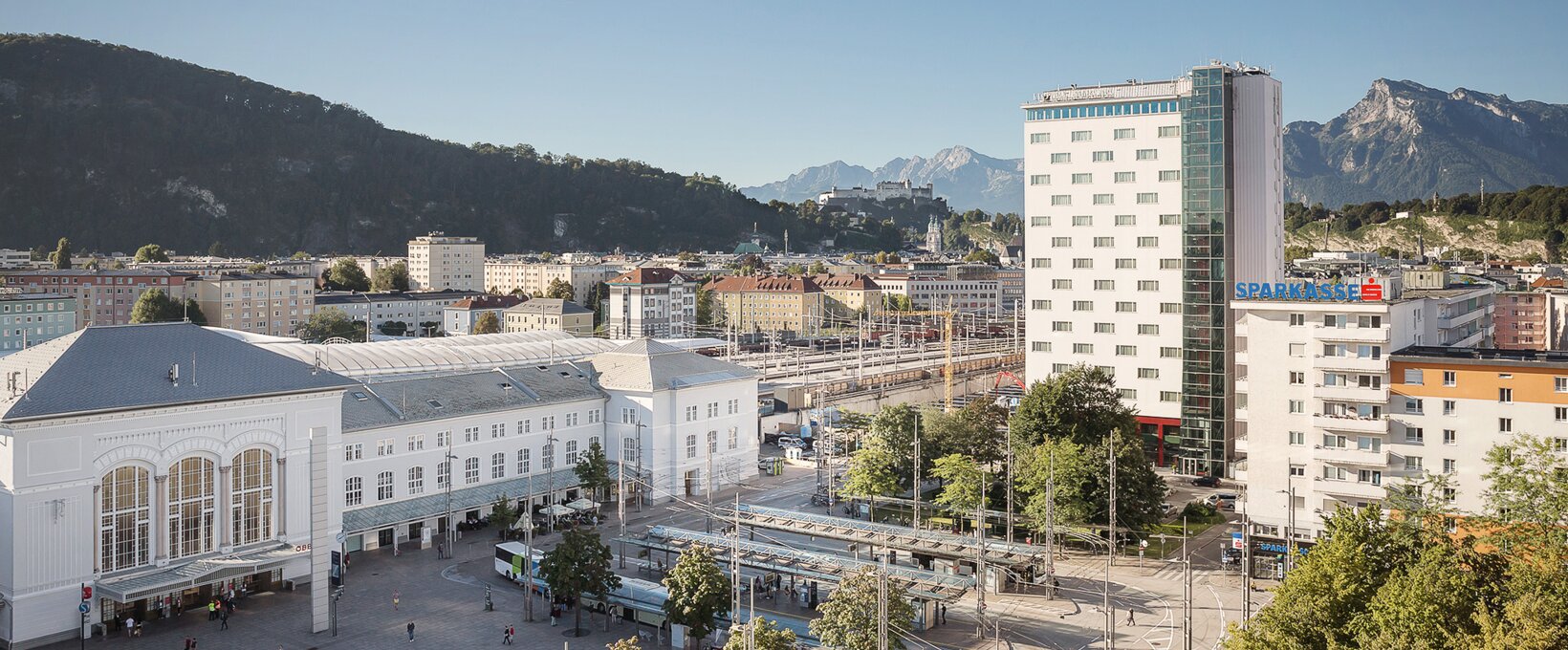 Exterior view with view to the train station and Salzburg city | Hotel Europa Salzburg