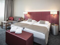Premium Room sleeping area with couch | Hotel Europa Salzburg