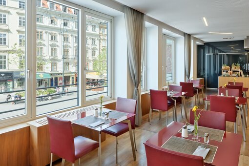 Breakfast room with laid table | Hotel Europa Wien 