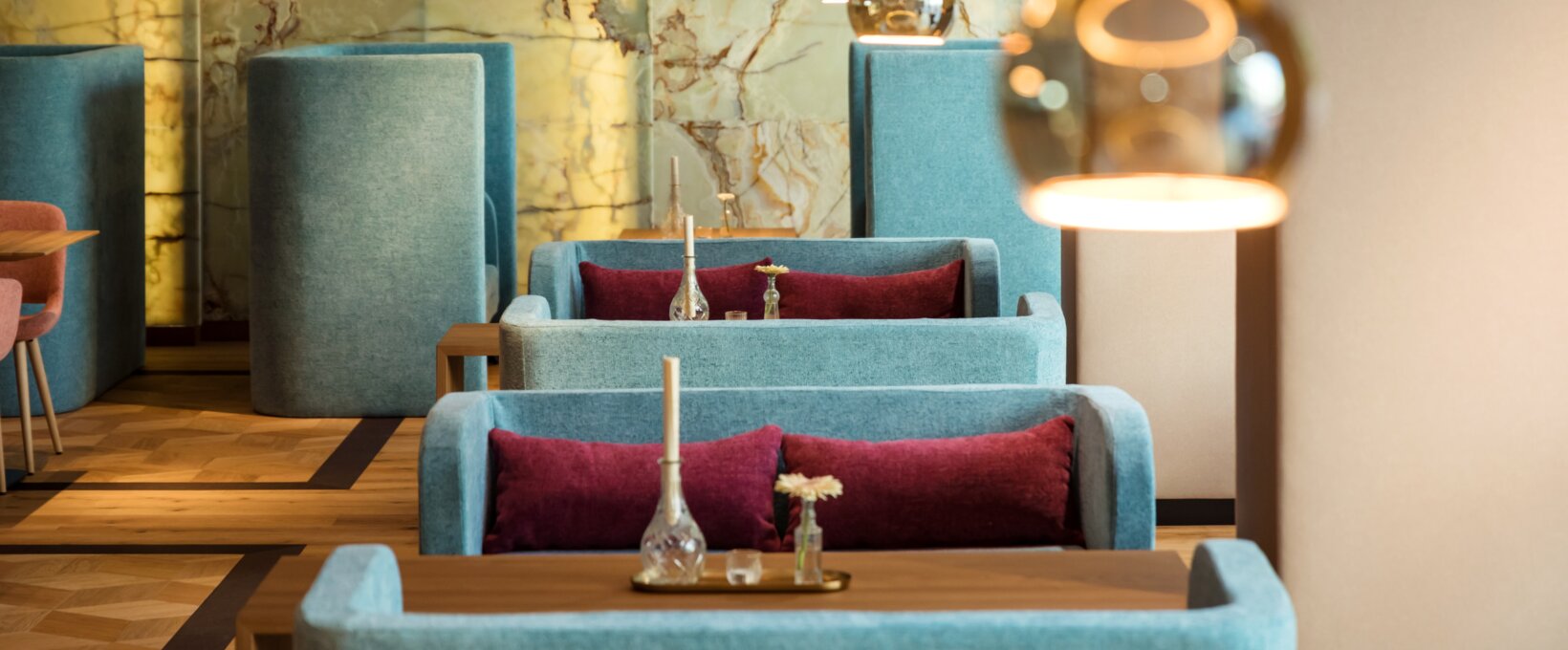 View of tables in the restaurant/lounge area at the Hotel Maximilian