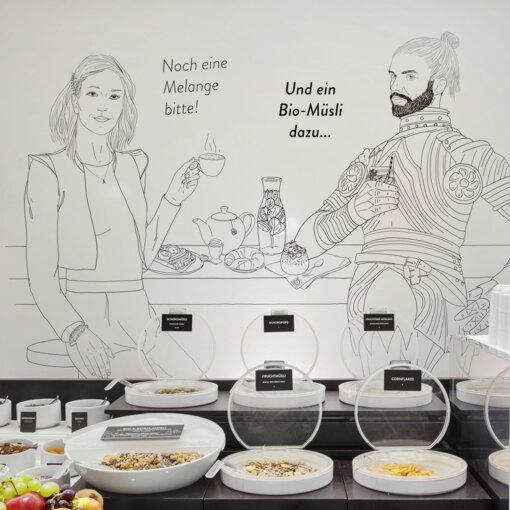 Breakfast buffet | Hotel Rathauspark in Vienna Breakfast buffet with mural | Hotel Rathauspark in Vienna
