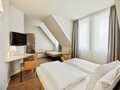 Premium Room living and sleeping area | Hotel Theresianum in Vienna
