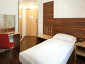 Classic Single Room with twin bed, desk and seating | Hotel Theresianum in Vienna